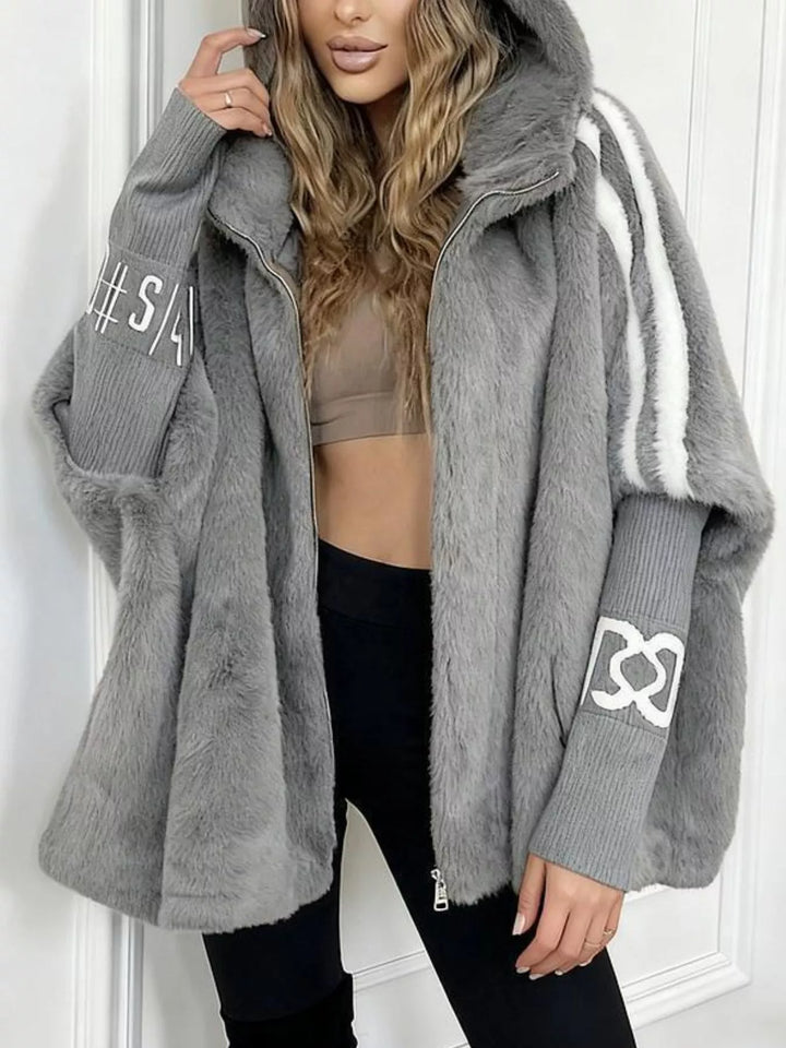 Hooded faux fur coat with striped trim and knit sleeves