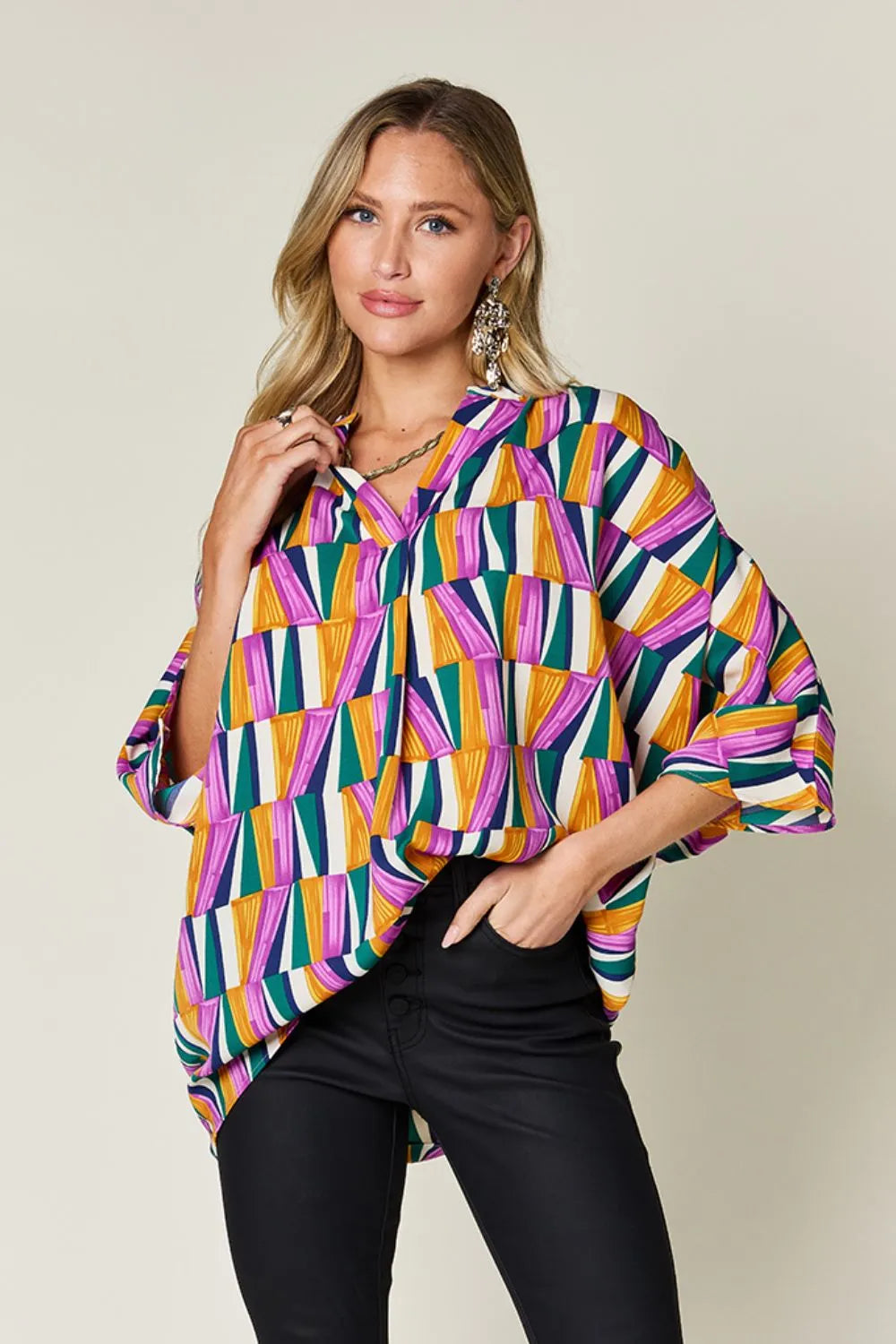 Geometric print notched neck dolman sleeve top