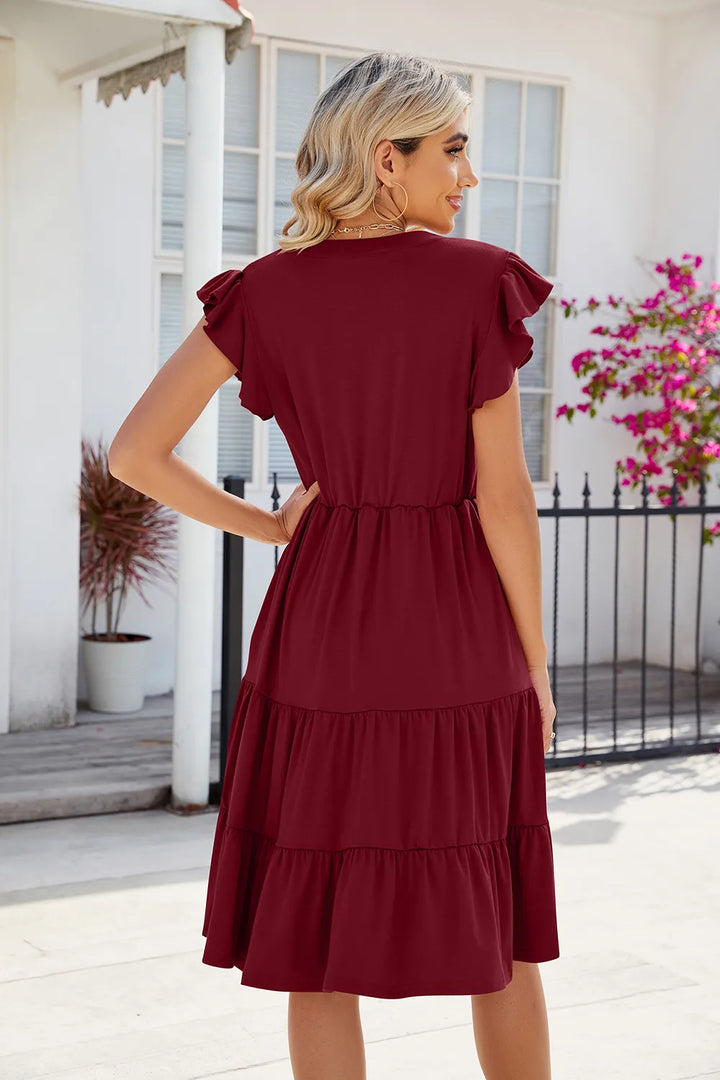 Flutter sleeve tiered midi dress with notched V-neck