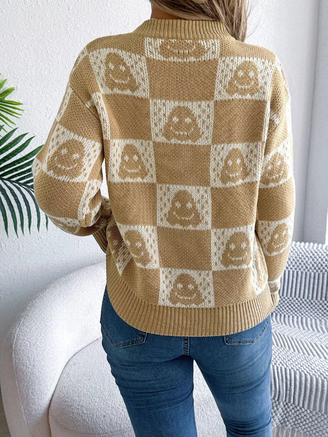 Checkered ghost print crew neck sweater with ribbed cuffs
