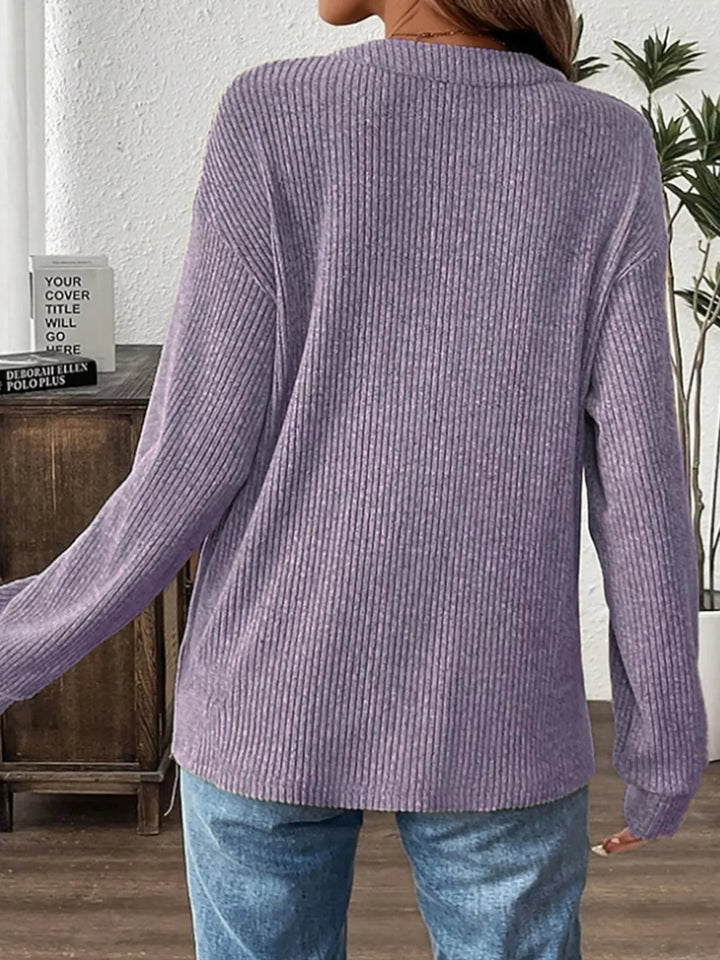 Ribbed knit long sleeve henley top with button placket