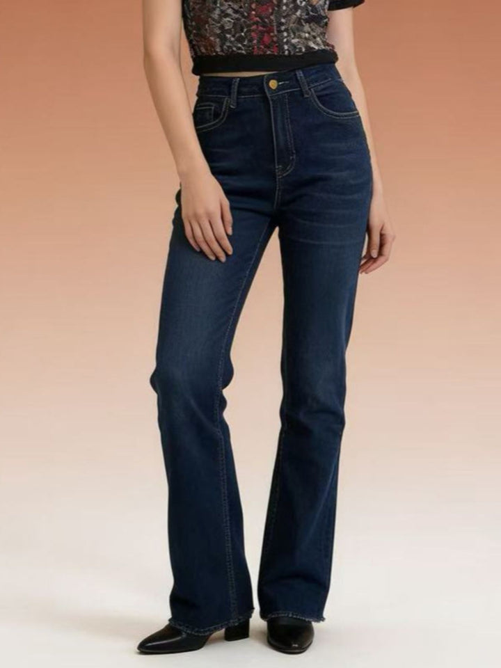 High-rise bootcut jeans with yoke seam and raw hem