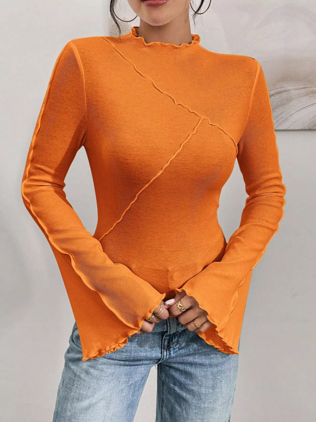 Ribbed knit mock neck top with lettuce-edge flare sleeves