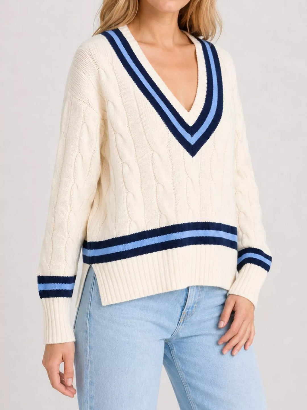 Cable knit v-neck cricket sweater with striped trim