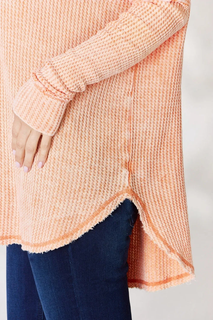 Oversized waffle knit long sleeve top with exposed seams