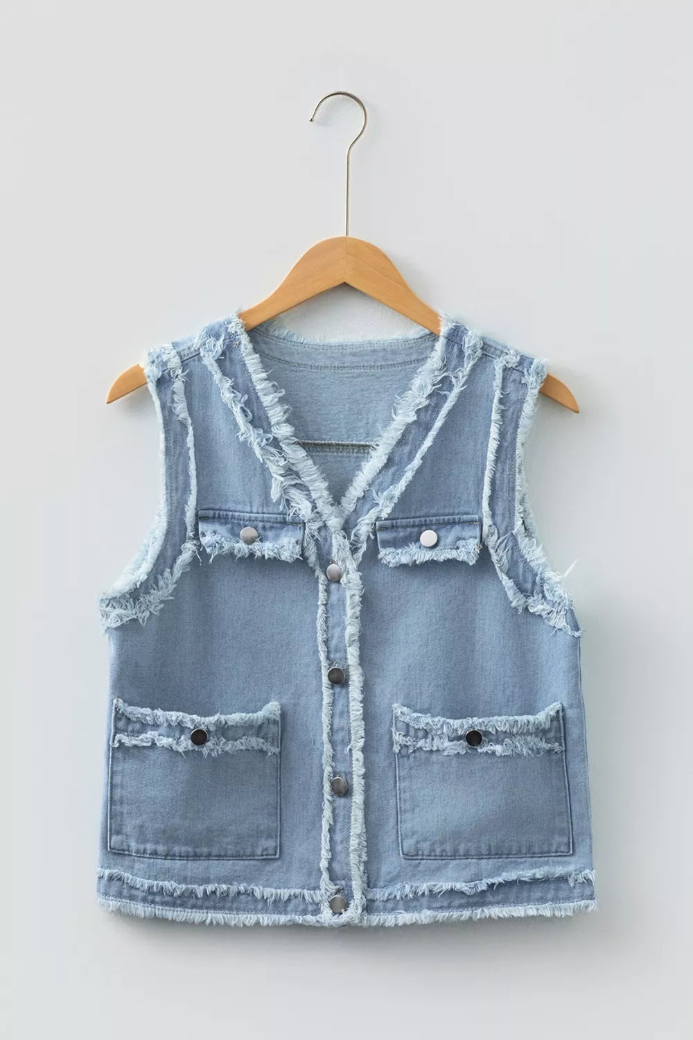 Frayed edge denim vest with snap flap pockets