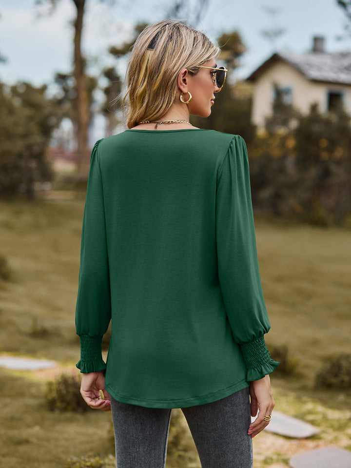 Pintuck pleated puff sleeve blouse with smocked cuffs