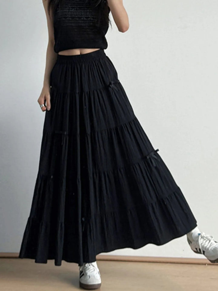Tiered bow-accent maxi skirt with elastic smocked waist