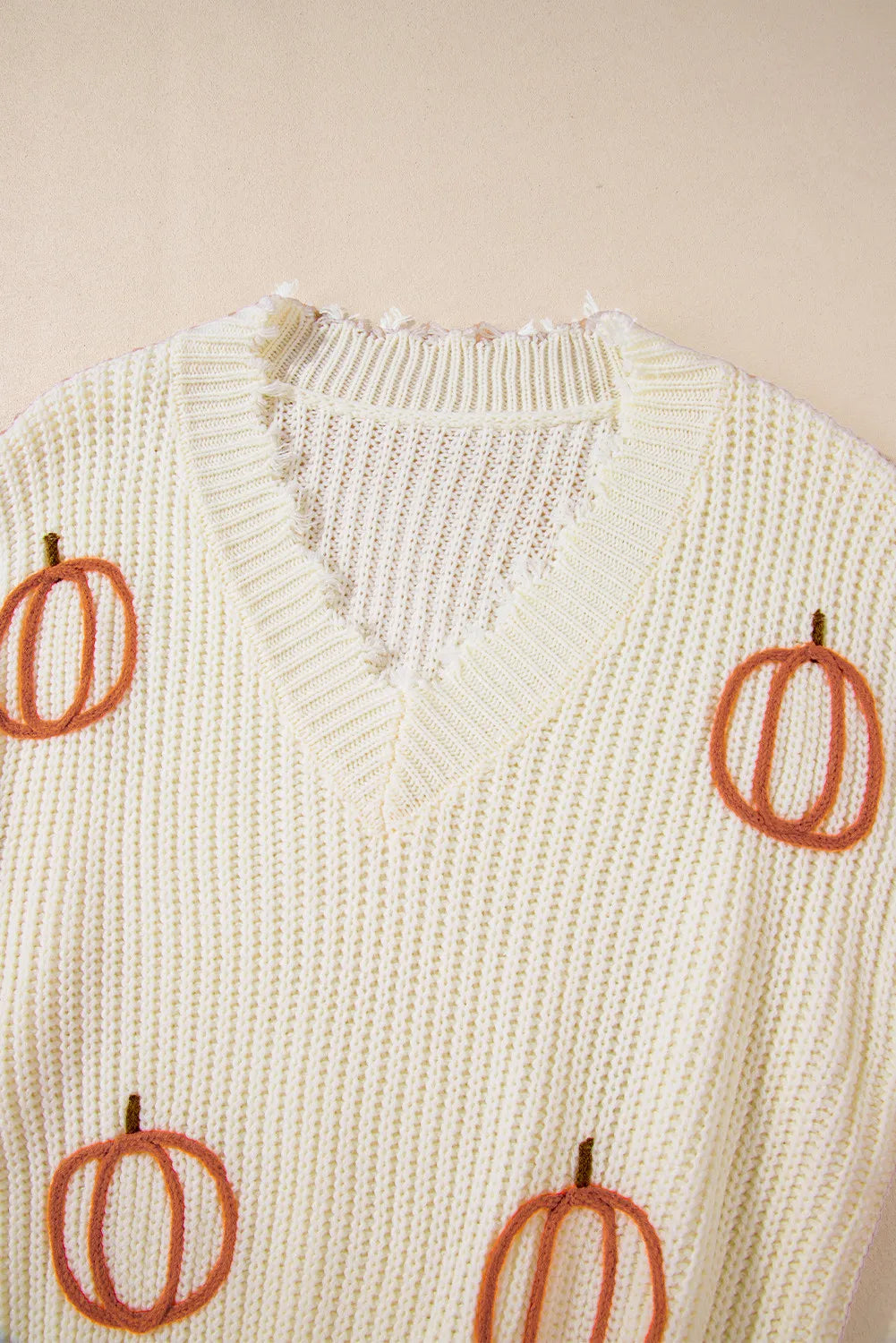 Pumpkin embroidered chunky knit sweater with frayed raw hem