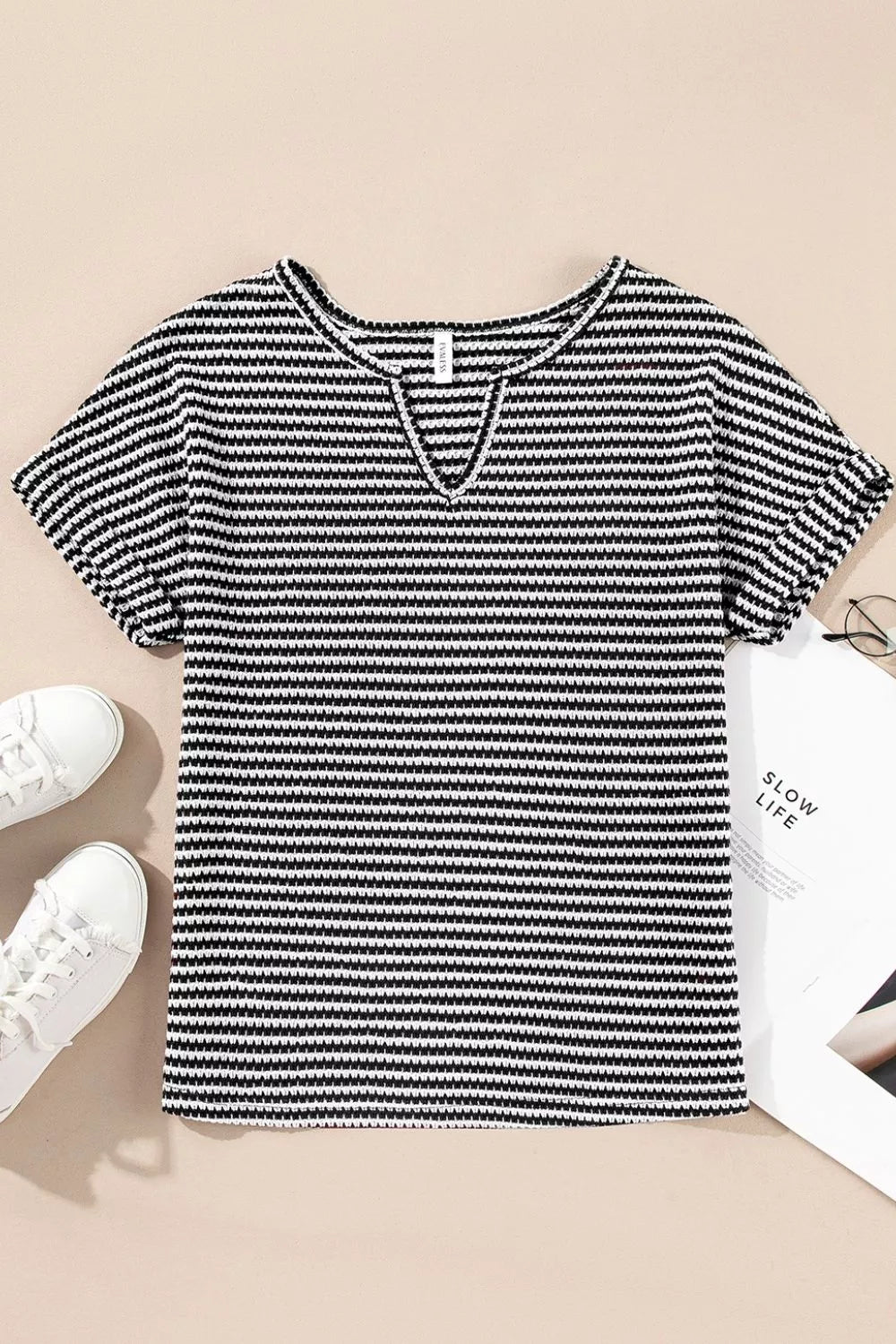 Striped textured knit top with notched V-neck and cuffed sleeves