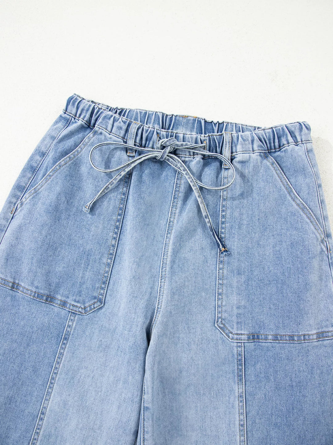 Wide-leg drawstring jeans with raw frayed hem