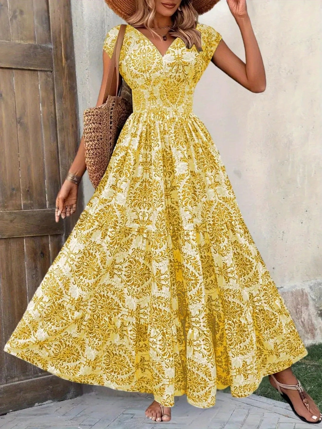 Smocked tiered maxi dress with cap sleeves and side slit