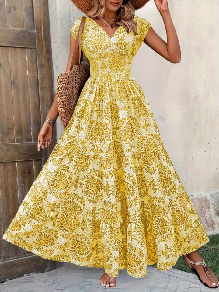 Smocked tiered maxi dress with cap sleeves and side slit