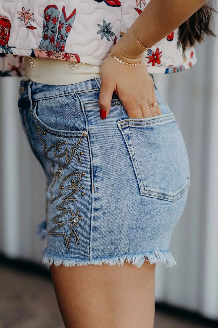 Western embroidered studded denim shorts with raw hem
