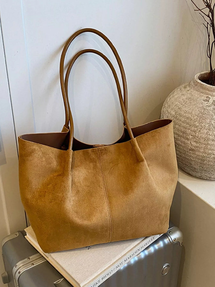 Large slouchy suede shoulder tote bag with pom charm
