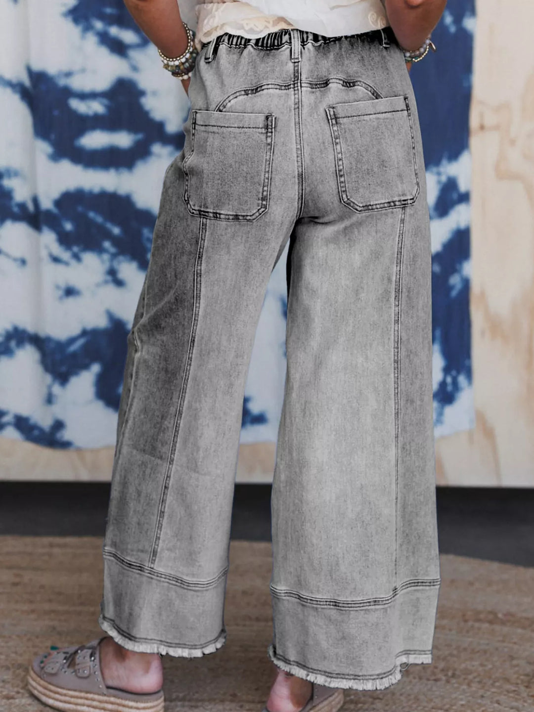 Wide-leg drawstring jeans with raw frayed hem