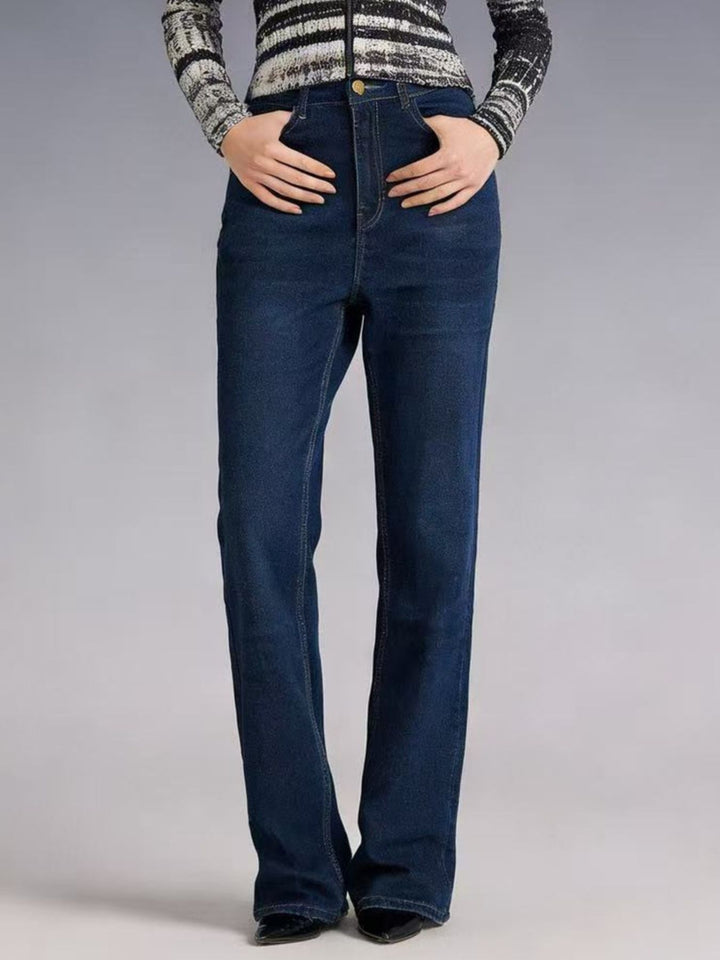 High-rise bootcut jeans with yoke seam and raw hem