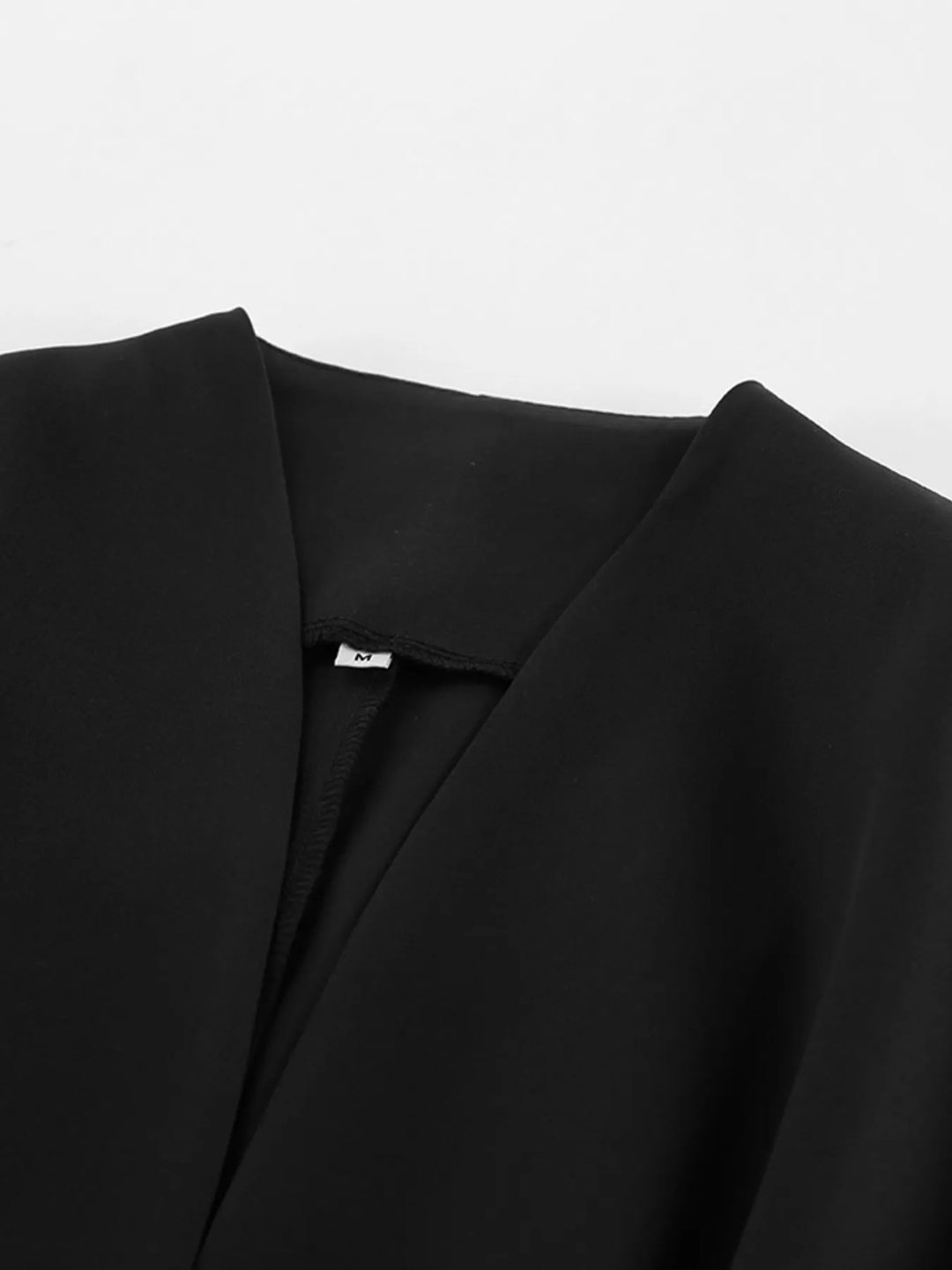 Collarless button-front jacket with cinched pleated waist