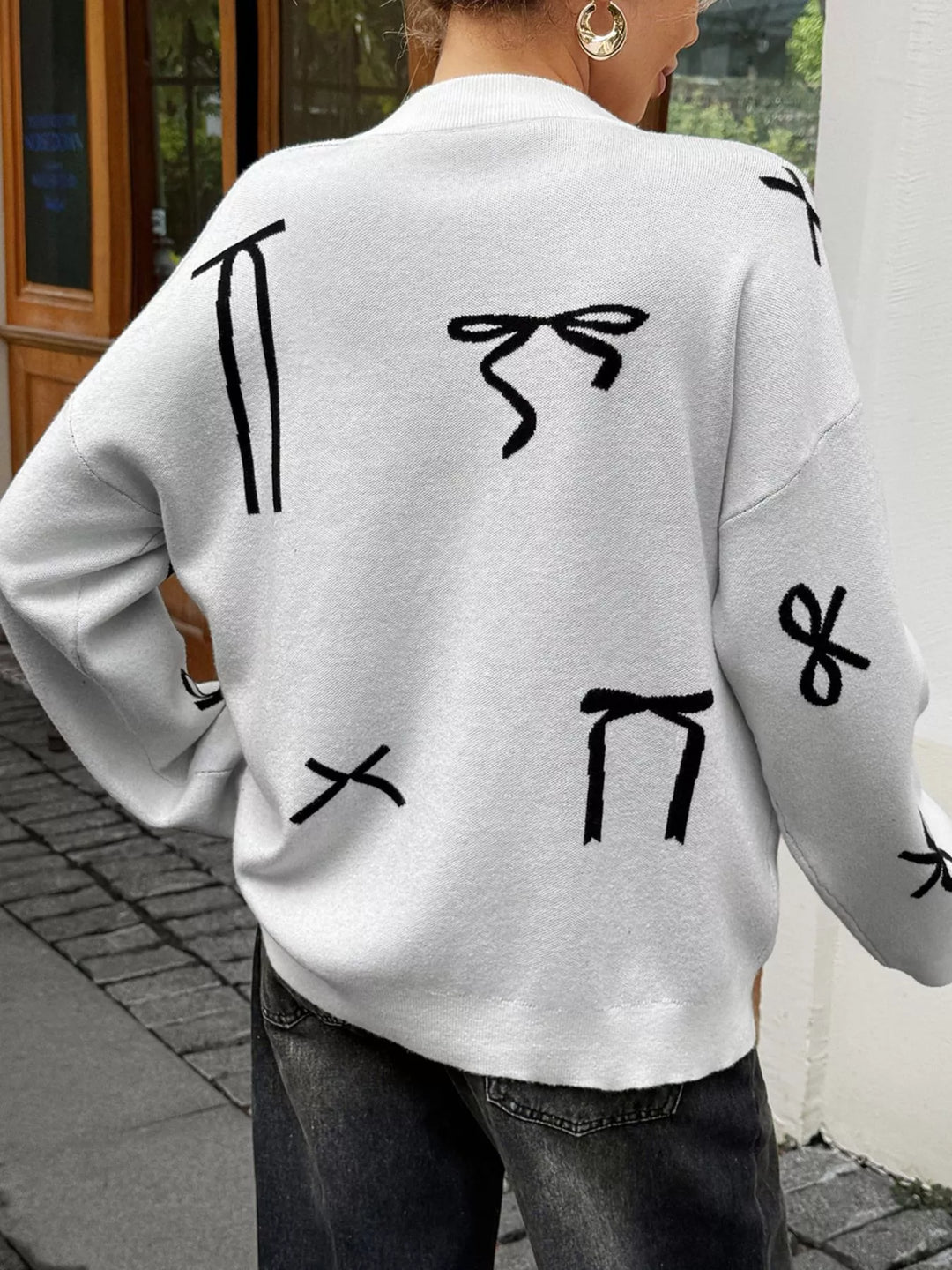 Bow print dropped-shoulder round neck sweater