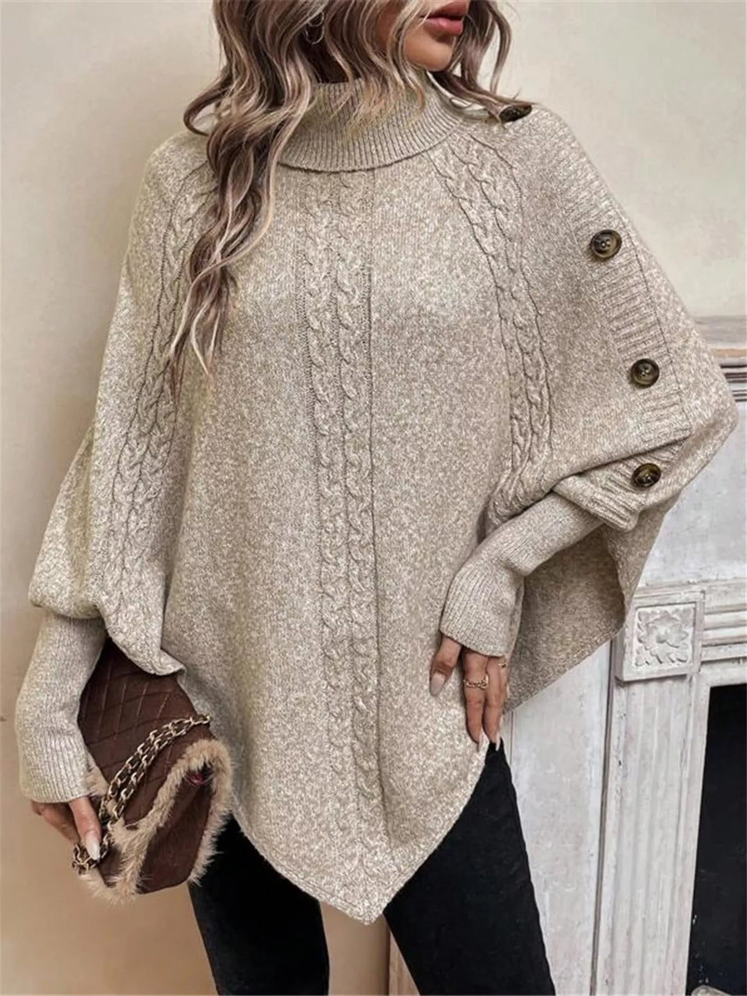 Cable knit turtleneck cape sweater with button shoulder