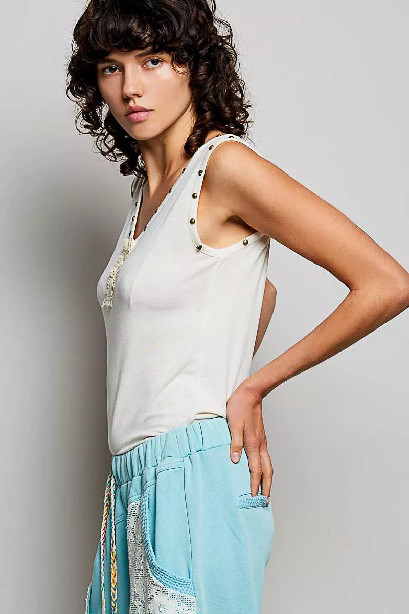 Studded V-neck sleeveless knit tank with button-front ruffle