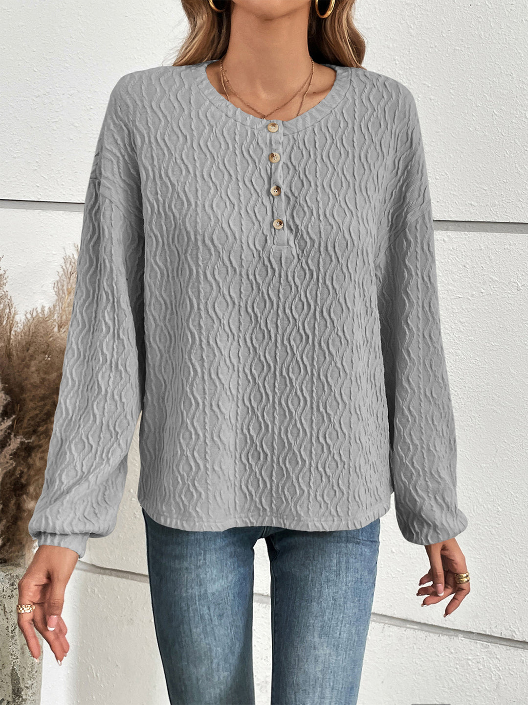 Textured half-button henley top with long sleeves