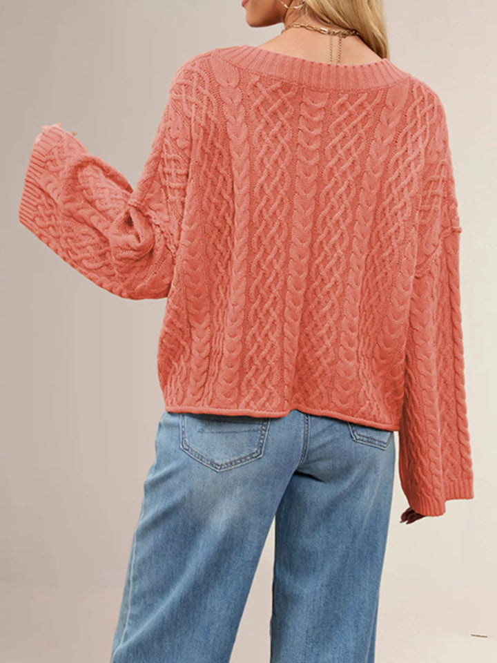 Cable knit button-front cardigan with patch pockets