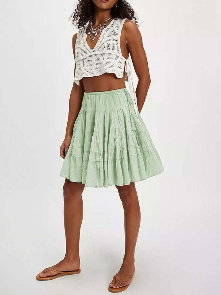 Sage Tiered ruffle mini skirt with drawstring waist