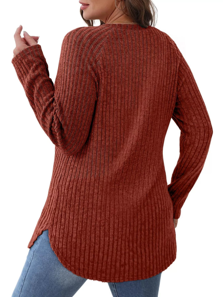 Ribbed knit crew neck long sleeve top with curved hem