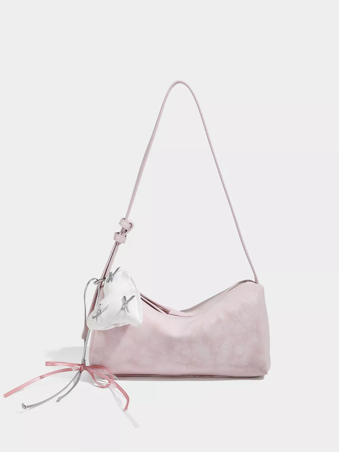 Adjustable strap crossbody bag with heart charm and bow trim