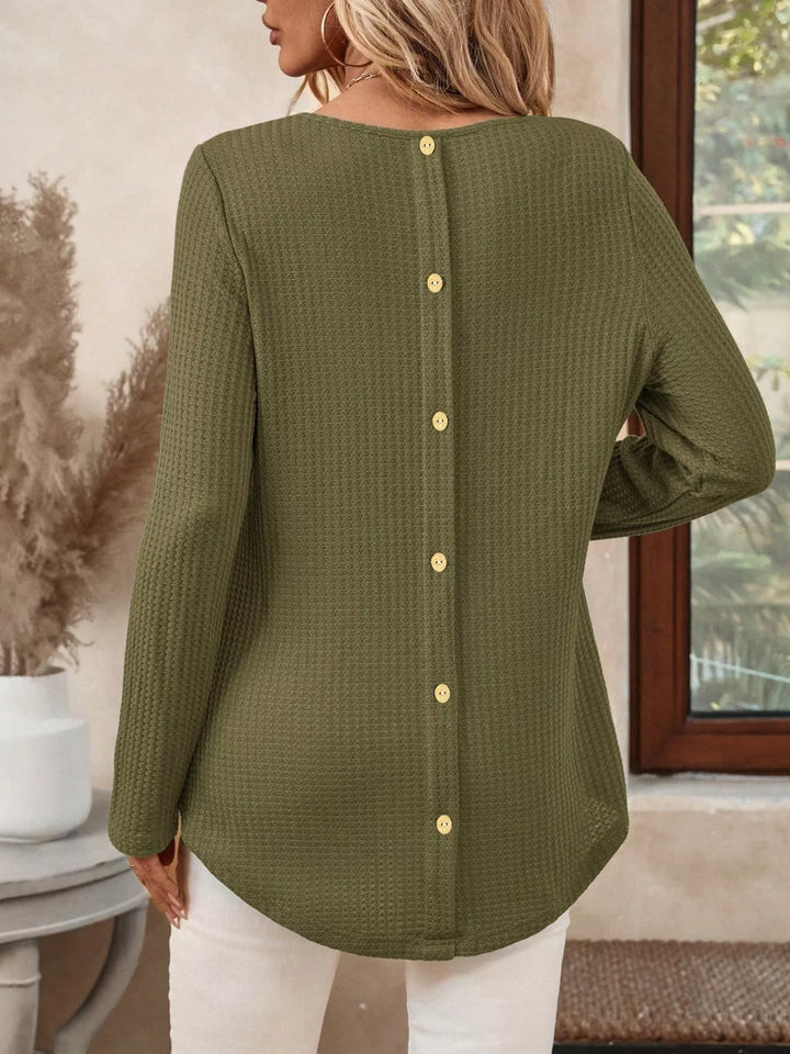 Waffle knit crew neck long sleeve top with curved hem