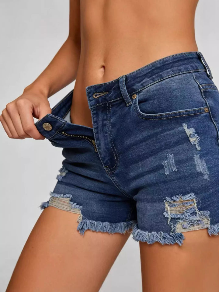 Distressed high-rise denim shorts with frayed raw hem