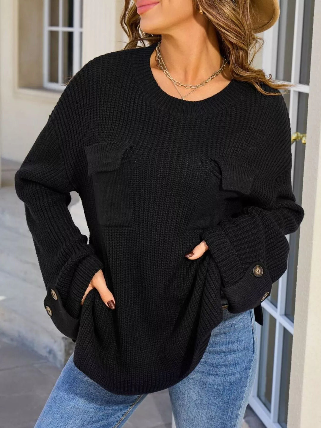 Black Ribbed knit sweater with chest pockets and button cuffs