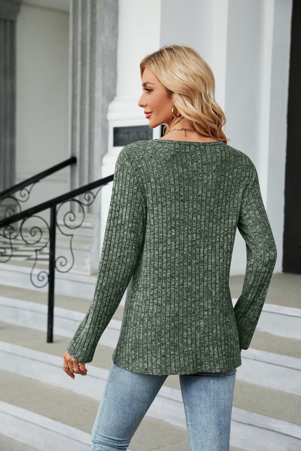 Ribbed knit long sleeve top with side buttons and slit hem