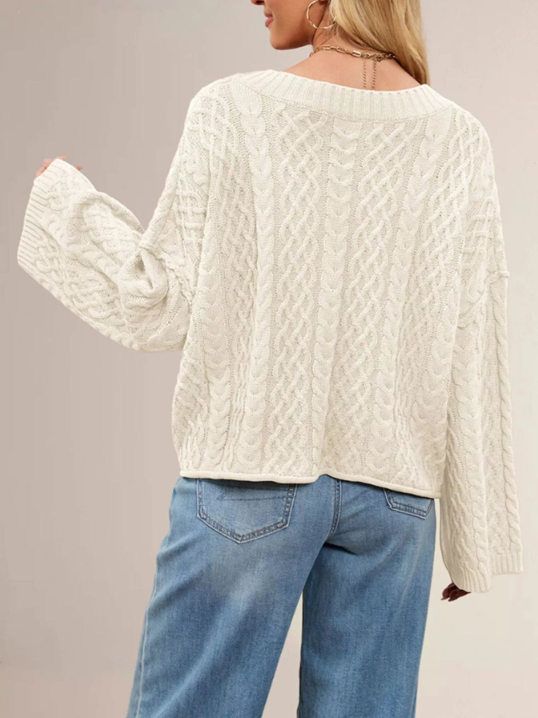 Cable knit button-front cardigan with patch pockets