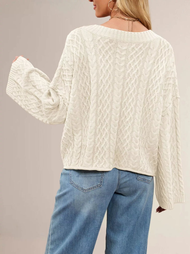 Cable knit button-front cardigan with patch pockets