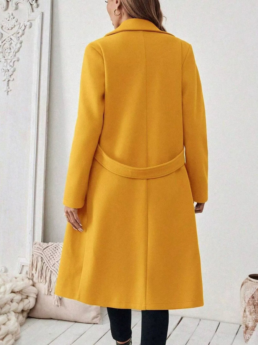 Longline notch lapel coat with single-button waist tab