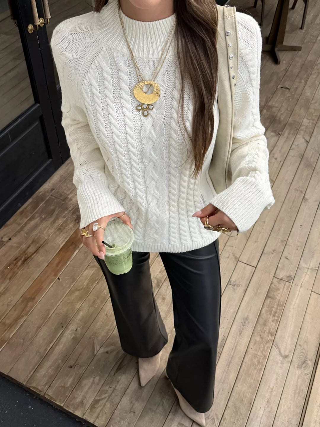 Cable-knit mock neck sweater with shoulder buttons