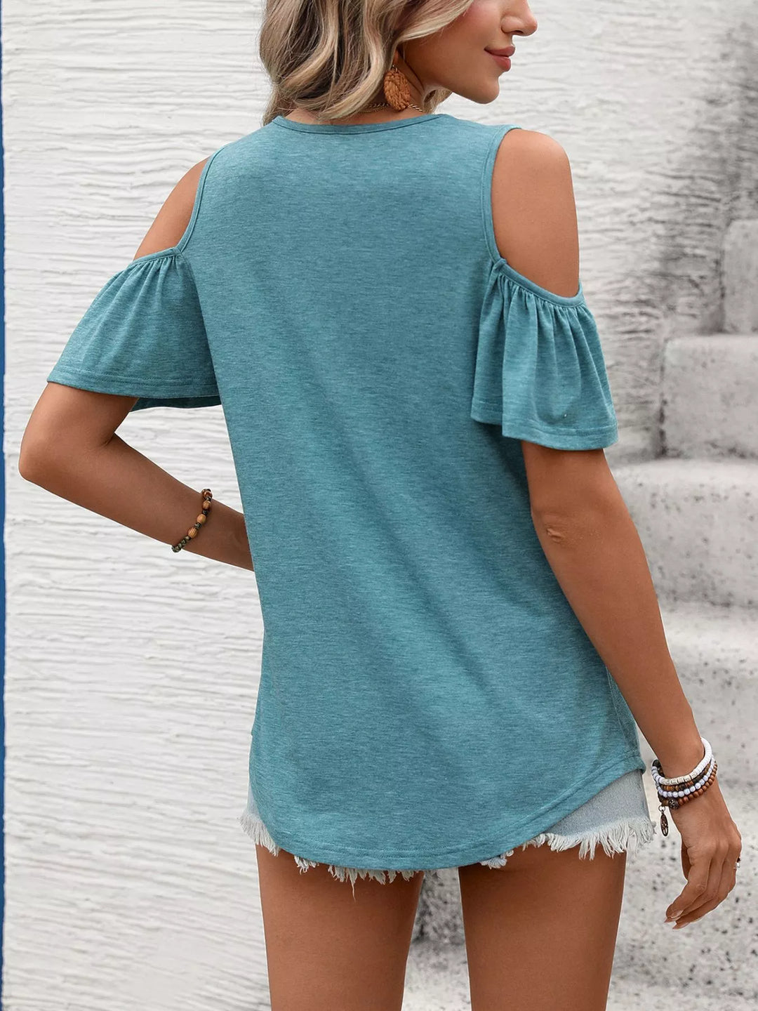 Cold shoulder V-neck top with ruched chest and ruffle sleeves