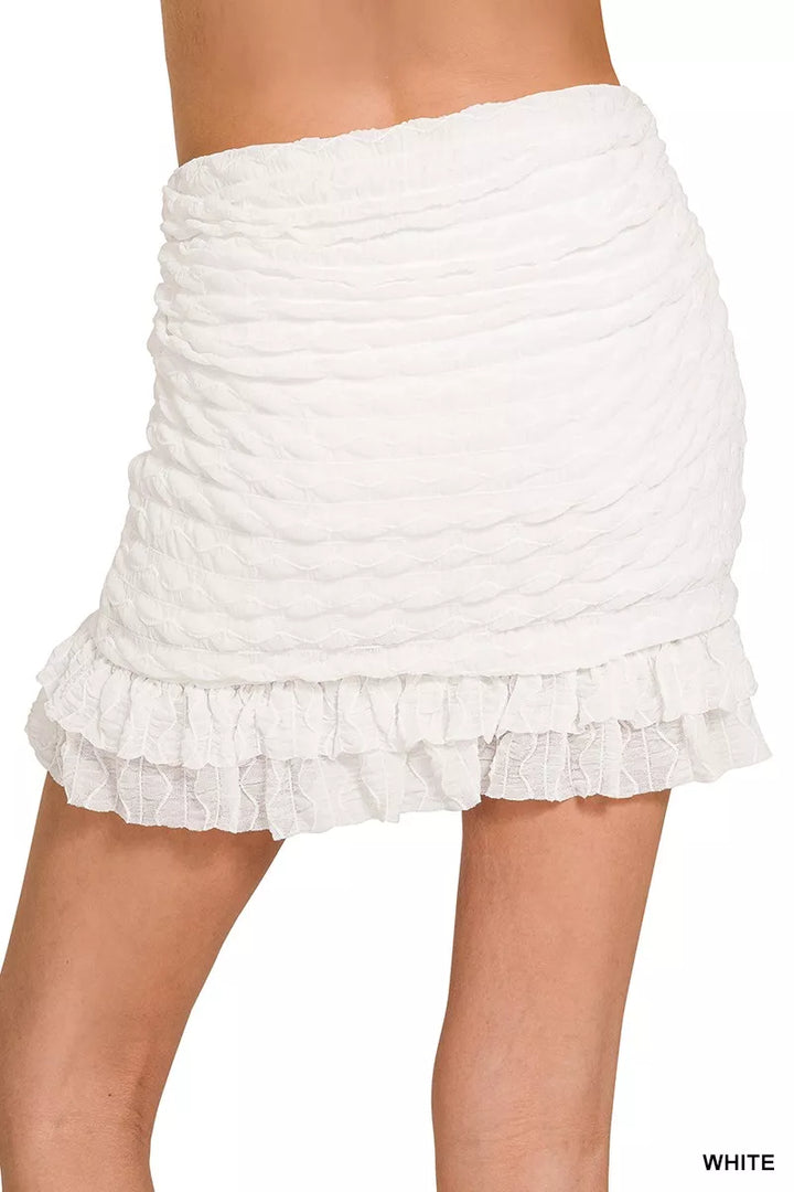 Ruched mini skirt with built-in shorts and ruffle hem