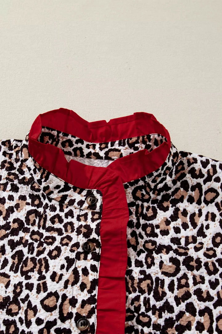 Leopard print short sleeve button-down with contrast ruffle trim