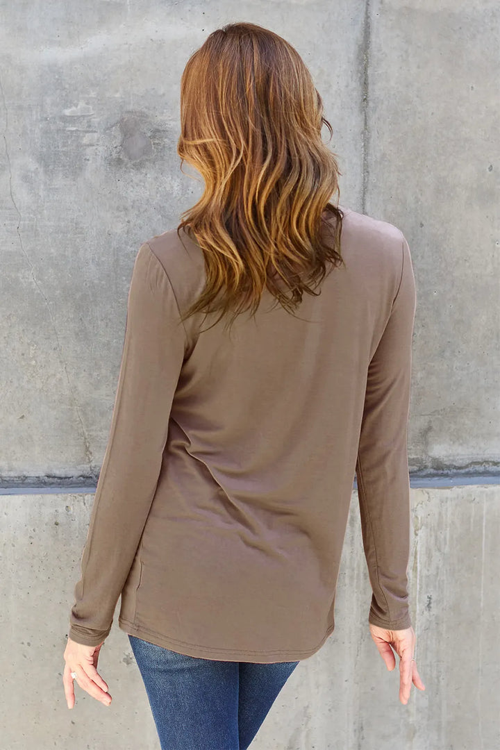 Crew neck long sleeve top with curved hem