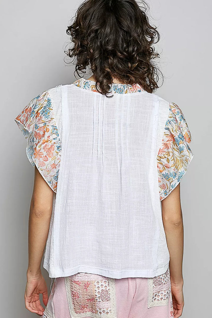 V-neck woven cotton blouse with floral ruffle cap sleeves