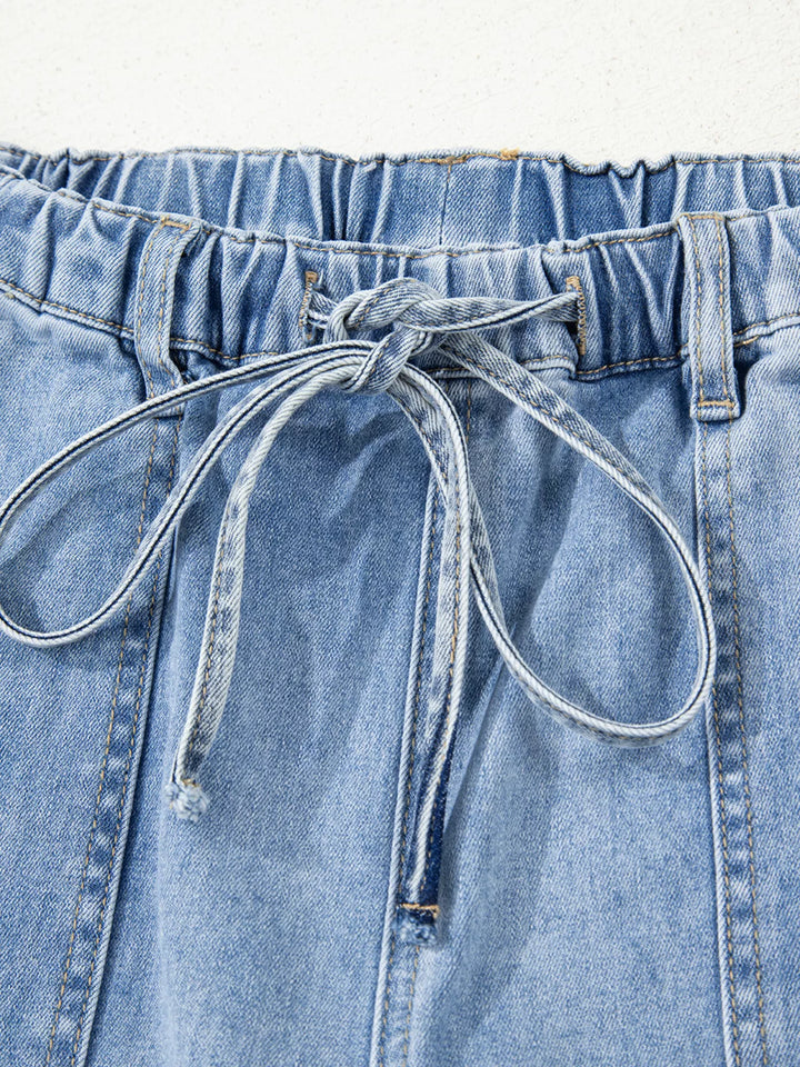 Wide-leg drawstring jeans with raw frayed hem