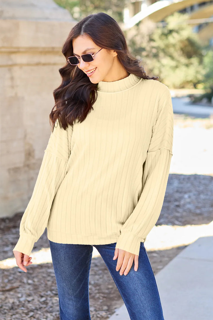 Light Yellow Ribbed exposed-seam mock neck knit top with drop shoulders