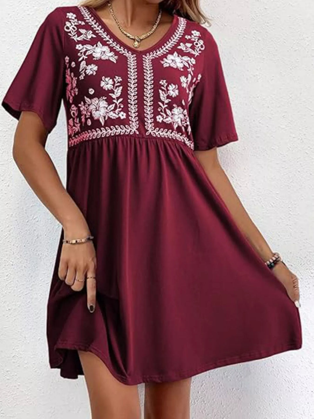 Floral embroidered v-neck babydoll mini dress