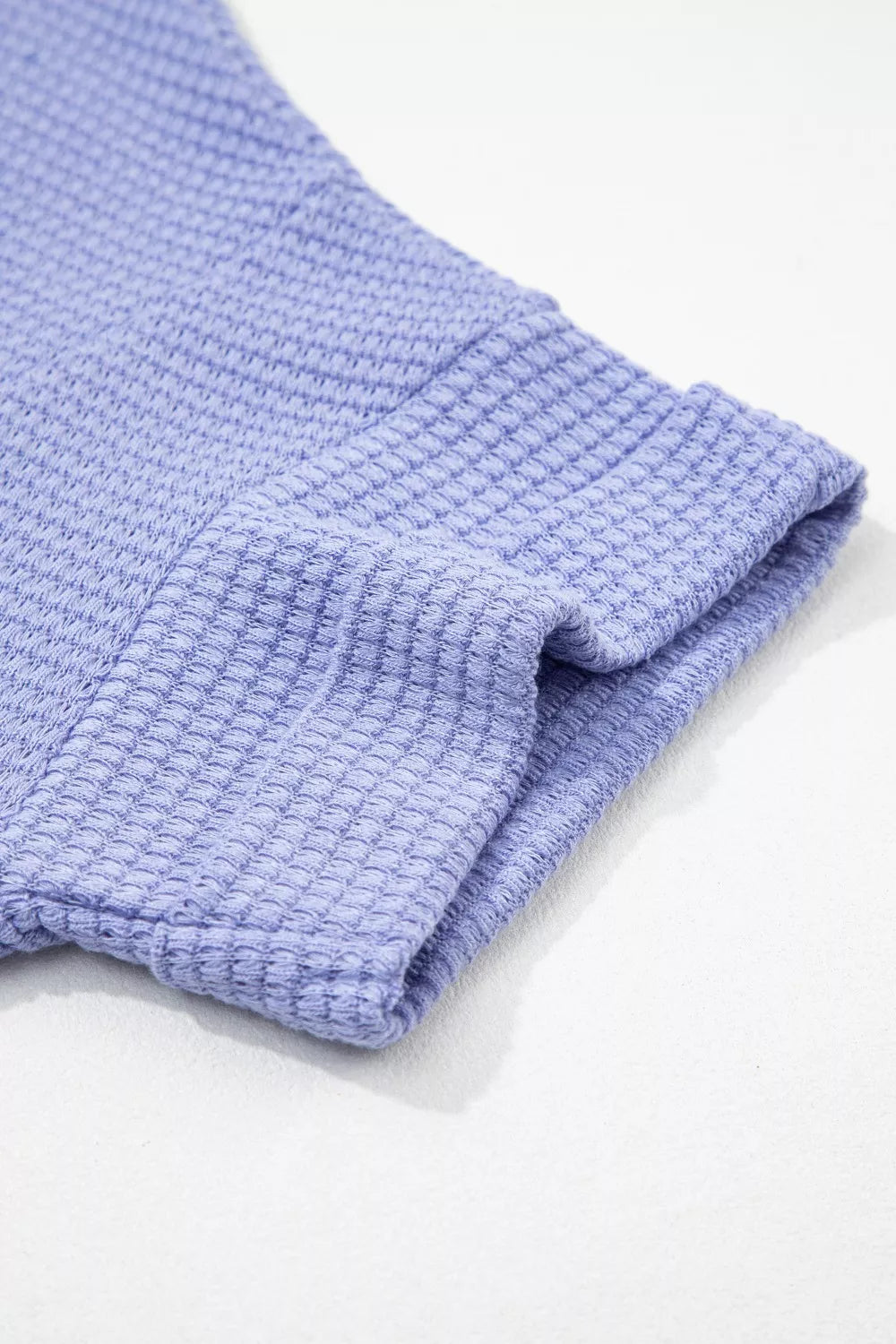 Plus size waffle knit V-neck top with cuffed short sleeves