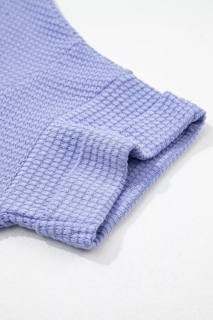 Plus size waffle knit V-neck top with cuffed short sleeves