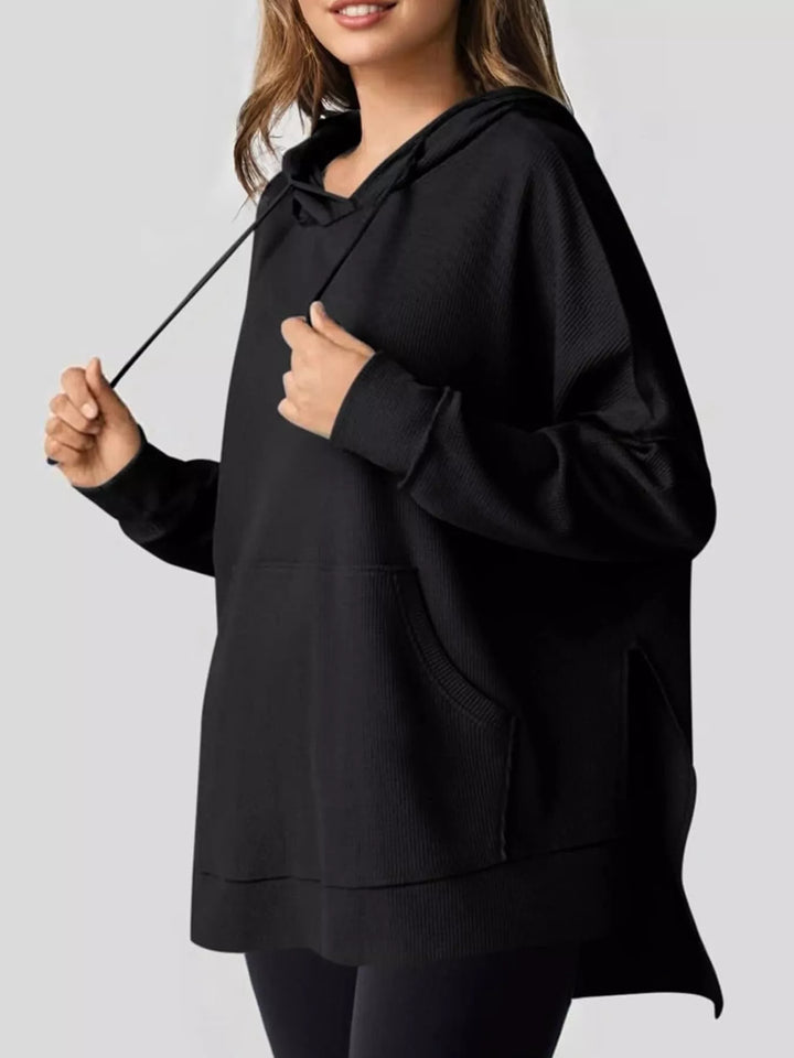 Black Oversized waffle-knit hoodie with side slits and front pocket
