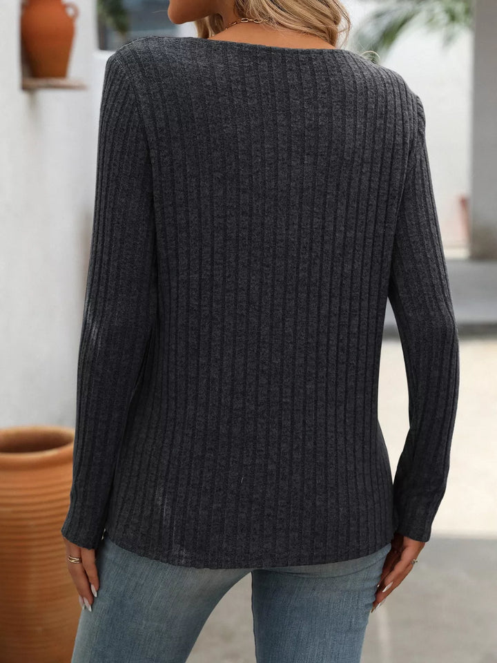 Ribbed knit long sleeve top with asymmetric button neckline